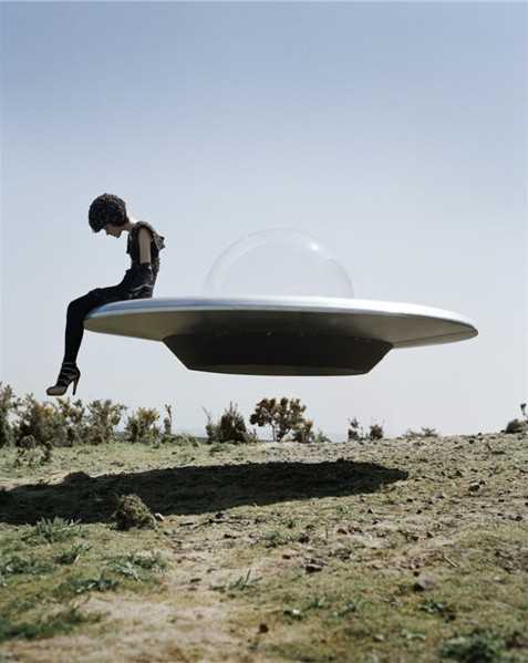 Lot 166 - Tim Walker (British 1970-), 'Kinga Rajzak On Flying Saucer, Eglingham Hall, Northumberland', 2009